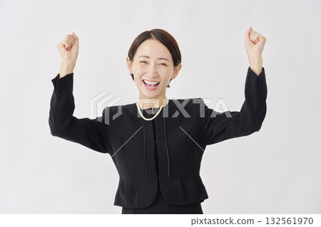 Woman in mourning clothes, fist pump, white background 132561970