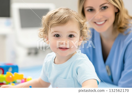 Occupational therapy session with young child practicing motor skills in a cheerful environment with supportive therapist Occupational therapy session with young child practicing motor skills in a cheerful environment with supportive therapist 132562170