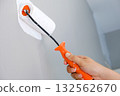 Home repairman paint the walls gray walls, painters use white paint brush rolls. 132562670