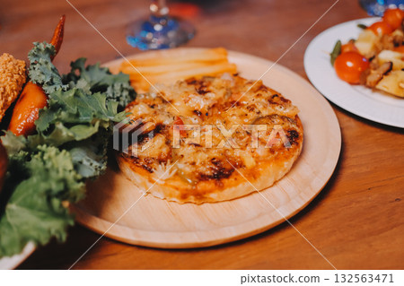 Joyful office Halloween party with coworkers in costumes, celebrating with drinks and laughter, fostering teamwork and festive spirit 132563471