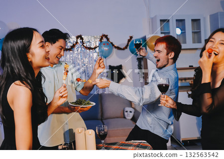 Diversity, dinner and group of people toast celebration together at party. Friends, happy and celebrate with food, wine and friendship for love, support and cheers champagne at business function 132563542