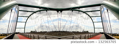 parallel metal bridges wide river urban. A stunning wide angle photo of a double-deck or double-span metal bridge crossing a wide river in an urban area. architecture emphasizes modern infrastructure parallel metal bridges wide river urban. A stunning wide angle photo of a double-deck or double-span metal bridge crossing a wide river in an urban area. architecture emphasizes modern infrastructure 132563705