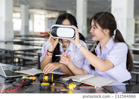 Students teen in uniform learning STEM with VR headset technology at school campus 132564066