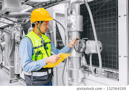 Professional engineer man working, Technician worker schedule check service pipe and valve system 132564289