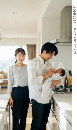 A man feeding a baby with a bottle 132564674