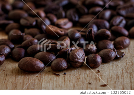 Freshly Roasted Coffee Beans on Wood. Freshly Roasted Coffee Beans on Wood. 132565032