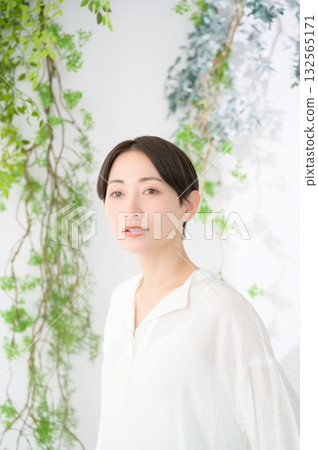 Japanese woman relaxing in a bright room Japanese woman relaxing in a bright room 132565171