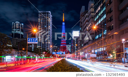 Tokyo Tower lit up in the colors of the American flag and the light trails of cars at an intersection Tokyo Tower lit up in the colors of the American flag and the light trails of cars at an intersection 132565493