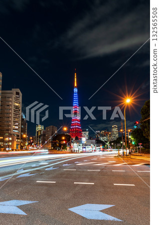 Tokyo Tower lit up in the colors of the American flag and the light trails of cars at an intersection Tokyo Tower lit up in the colors of the American flag and the light trails of cars at an intersection 132565508
