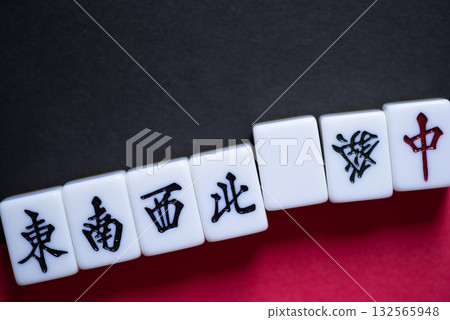 mahjong tiles lined up 132565948