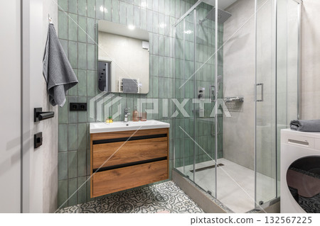Modern Bathroom with Green Tiles and Wooden Vanity Modern Bathroom with Green Tiles and Wooden Vanity 132567225