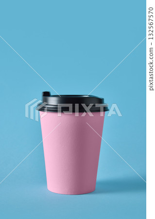 Pink takeaway coffee cup with black lid on blue background for cafe packaging Pink takeaway coffee cup with black lid on blue background for cafe packaging 132567570