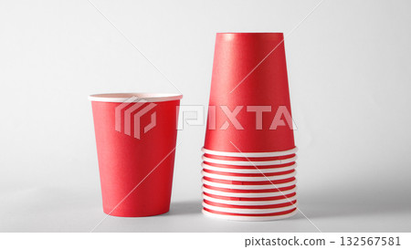 Stack of red paper cups on white background for beverage packaging and branding 132567581
