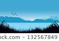 Silhouettes of mountain landscape, calm lake, flying birds, and grass in shades of blue. Minimalist nature vector illustration 132567849