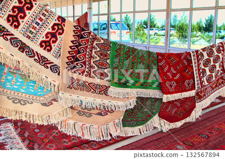 Pavilion selling Turkmen handmade carpets. Handmade carpets with traditional ornament. Turkmenistan. Ashkhabad market. 132567894