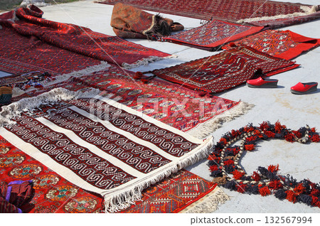 Handmade carpets with traditional ornament. Turkmenistan. Ashkhabad market. Handmade carpets with traditional ornament. Turkmenistan. Ashkhabad market. 132567994