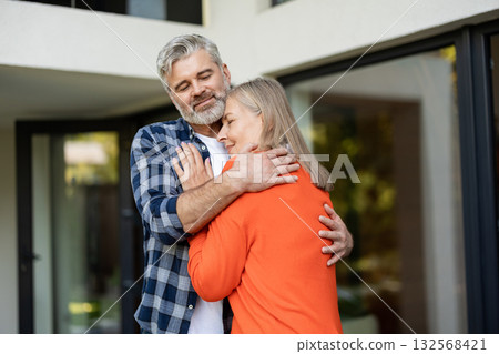 Mature couple feeling happy together and hugging each other 132568421