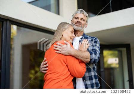 Mature couple feeling happy together and hugging each other Mature couple feeling happy together and hugging each other 132568432