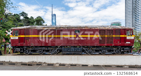 Malayan Railways locomotive 22102 exhibit in front of National Museum of Malaysia, Kuala Lumpur, Malaysia, with Merdeka 118. 132568614