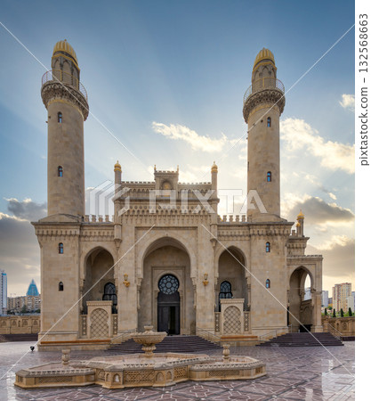 Taza Pir Mosque, a prominent landmark with minarets, golden domes, and fountain in Baku, Azerbaijan 132568663