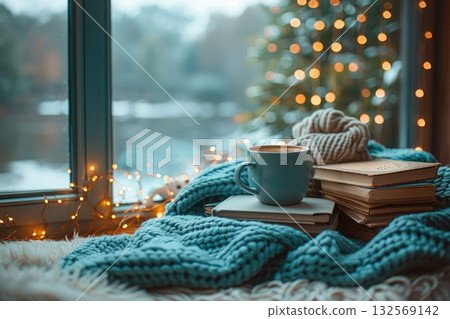 Christmas or new year decoration -cup of coffee with books. Christmas tree. Living room interior and holiday home decor concept. 132569142