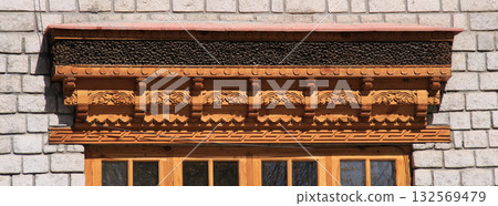 Traditional carved window lintel in Leh, India. Traditional carved window lintel in Leh, India. 132569479
