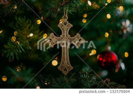 Closeup scene of the beautiful Christmas Cross on an illuminated Christmas Tree. 132570804
