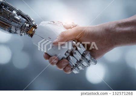 Human hand shaking robotic hand symbolizing technology cooperation 132571268