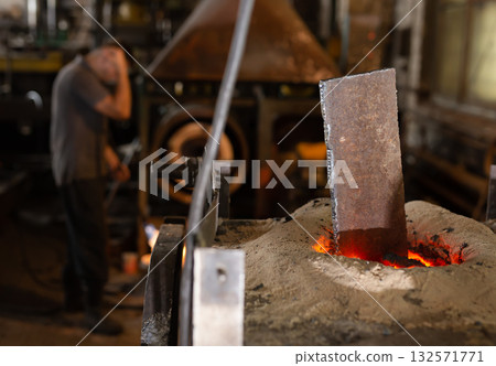 Foundry - ferrous metal is melted in an induction furnace of metallurgical plant Foundry - ferrous metal is melted in an induction furnace of metallurgical plant 132571771