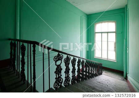 An Elegant Staircase set against Mint Green Walls that enhances the visual appeal of the space An Elegant Staircase set against Mint Green Walls that enhances the visual appeal of the space 132572016
