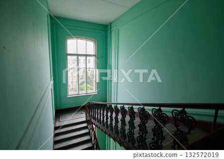 Aesthetic stairs gracefully surrounded by lush green walls and illuminated by bright natural light Aesthetic stairs gracefully surrounded by lush green walls and illuminated by bright natural light 132572019