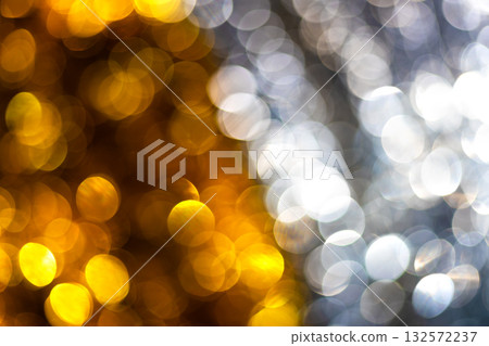 Golden and silver bokeh background with soft circular light reflections creating a luxurious and festive texture. Ideal for elegant holiday design, celebration, glamour photo, modern artistic concepts Golden and silver bokeh background with soft circular light reflections creating a luxurious and festive texture. Ideal for elegant holiday design, celebration, glamour photo, modern artistic concepts 132572237