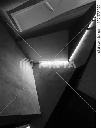 Abstract architectural space with sharp angles and glow edge light in black and white Abstract architectural space with sharp angles and glow edge light in black and white 132572372