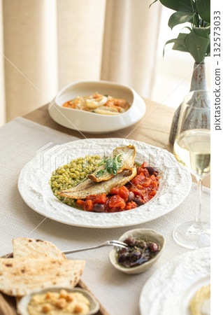 Grilled fish with vegetables and white wine Grilled fish with vegetables and white wine 132573033