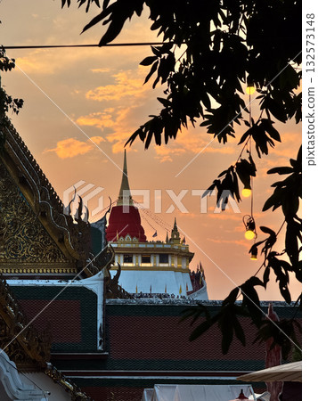 The Golden Mount Temple shines under a warm sunset sky in Bangkok reflecting peace faith and beauty of Thai culture. The Golden Mount Temple shines under a warm sunset sky in Bangkok reflecting peace faith and beauty of Thai culture. 132573148