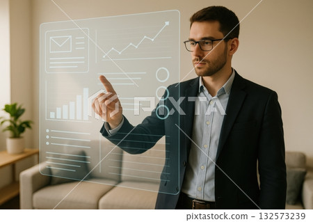 Business professional interacting with digital interface displaying data and analytics in modern office setting 132573239