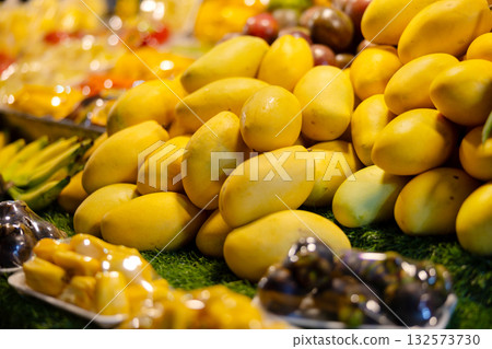 Fresh and ripe mangoes displayed at a vibrant Thai street market stall 132573730
