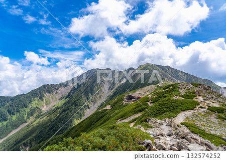 Mt. Ainotake and Mt. Nakashirane seen from the hiking trail to Kitadake Sanso. Climbing Mt. Kitadake in the Southern Alps Mt. Ainotake and Mt. Nakashirane seen from the hiking trail to Kitadake Sanso. Climbing Mt. Kitadake in the Southern Alps 132574252