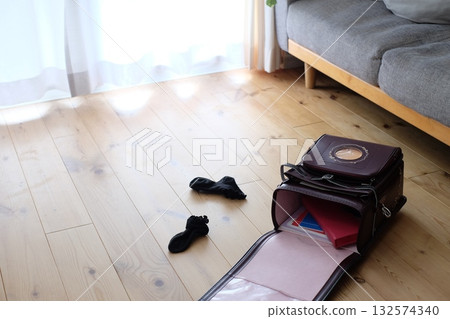 School bags and socks in the living room 132574340