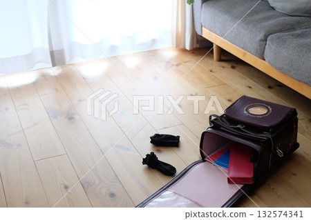 School bags and socks in the living room 132574341