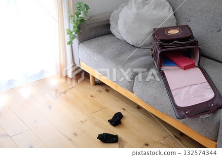 School bags and socks in the living room 132574344