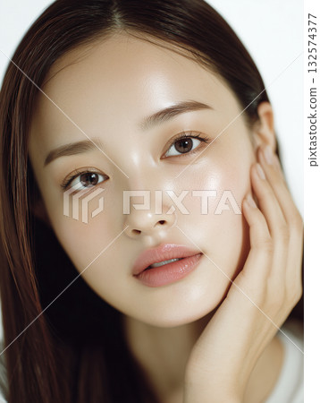Close-up of a woman's face with moisturized skin after applying beauty serum Close-up of a woman's face with moisturized skin after applying beauty serum 132574377