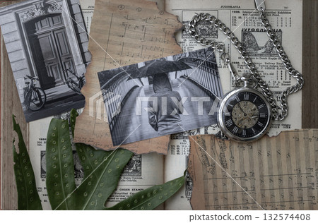 A nostalgic and artistic collage-style composition unfolds on the aged pages of a vintage book. It is a tapestry where time is captured and beautifully juxtaposed, featuring photographs of people and 132574408