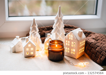Cozy Christmas Village Miniatures With Candlelight And Warm Home Decor Scene Cozy Christmas Village Miniatures With Candlelight And Warm Home Decor Scene 132574564