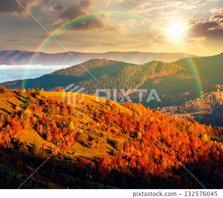 mountain landscape in autumn at sunset. scenic destination for a weekend in evening light. fog in the distant valley. forest on hills. weather forecast background with bright sky. countryside scenery mountain landscape in autumn at sunset. scenic destination for a weekend in evening light. fog in the distant valley. forest on hills. weather forecast background with bright sky. countryside scenery 132576045