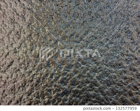 Textured frosted glass abstract background in avocado green 132577959