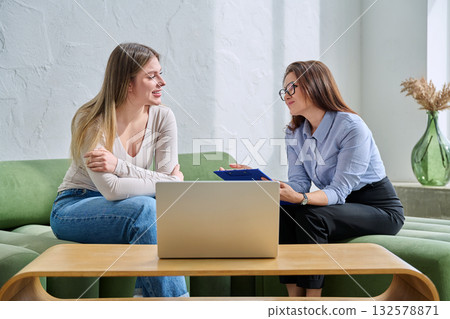 Young female patient during psychotherapy session with psychologist 132578871