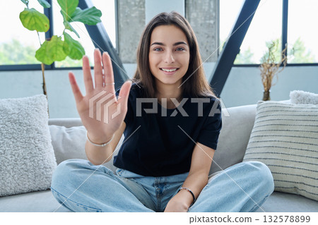Web camera view of teenage girl talking looking in camera, online meeting, video call Web camera view of teenage girl talking looking in camera, online meeting, video call 132578899