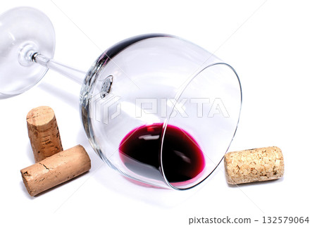 Wine glass and corks on a white background Wine glass and corks on a white background 132579064