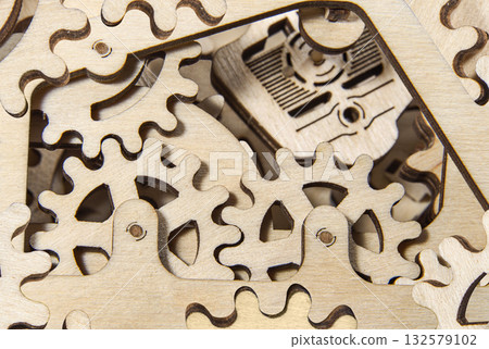 Wooden gear mechanism close up Wooden gear mechanism close up 132579102